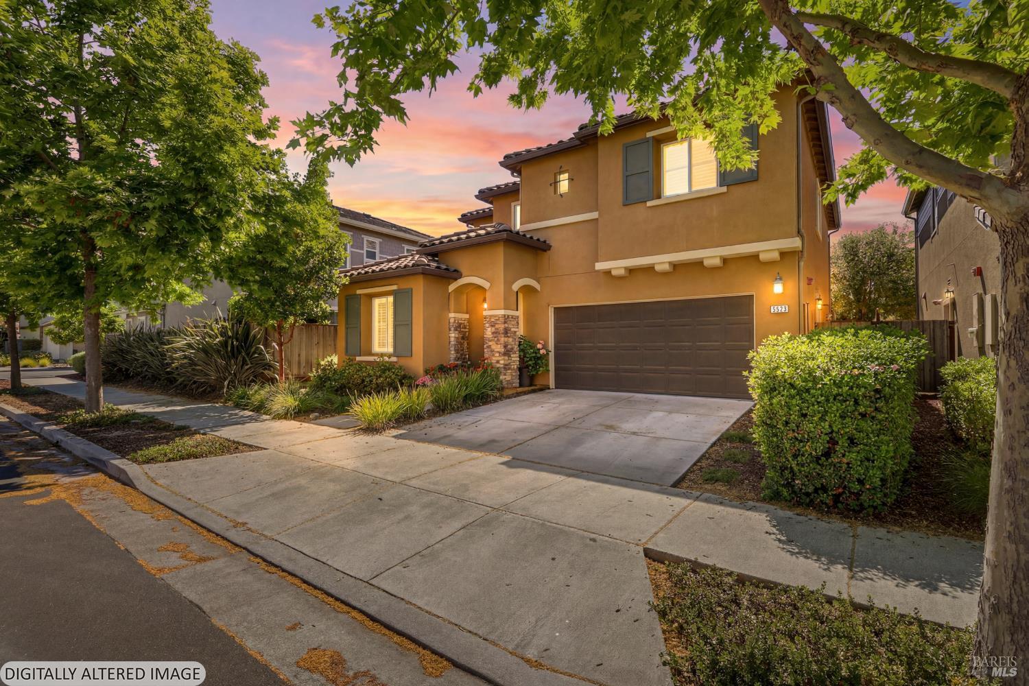 5533 Kennedy Place Rohnert Park, CA 94928 - Photo 63 of 63 a front view of a house with a yard and garage