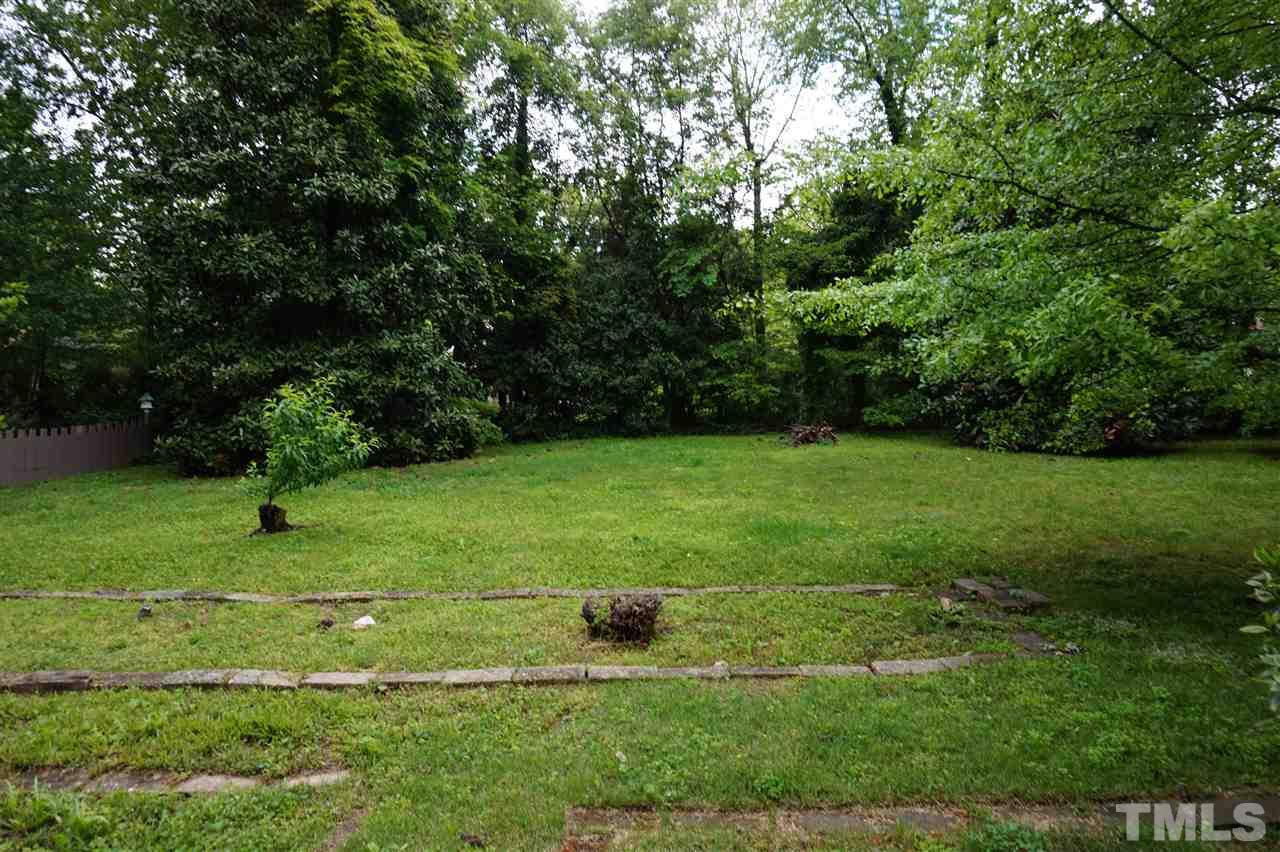 812 Runnymede Road Raleigh, NC 27607 - Photo 3 of 5 a view of a garden with a bench