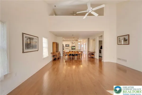 a view of a living room a patio and a chandelier