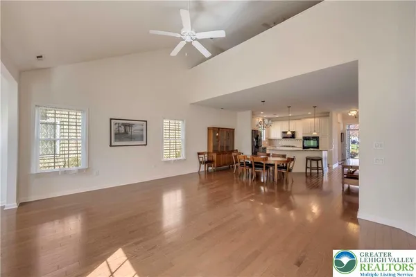 a view of dining room with furniture wooden floor and chandelier