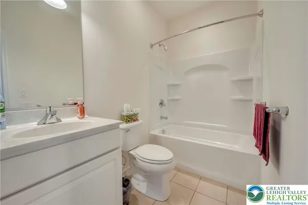 a bathroom with a sink a toilet and a bathtub