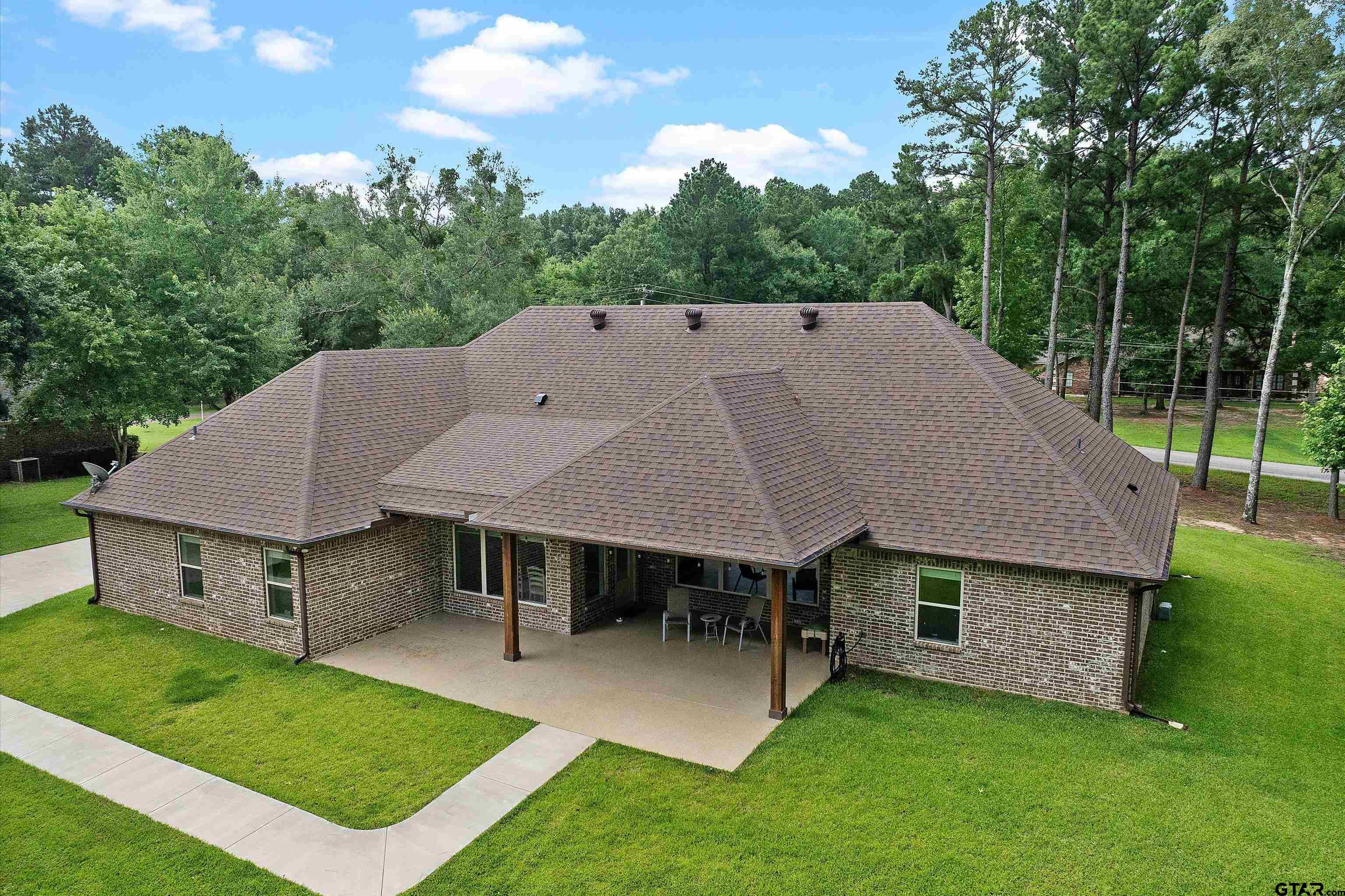 434 King Ranch Road Kilgore, TX 75662 - Photo 12 of 34 an aerial view of a house with swimming pool and a yard