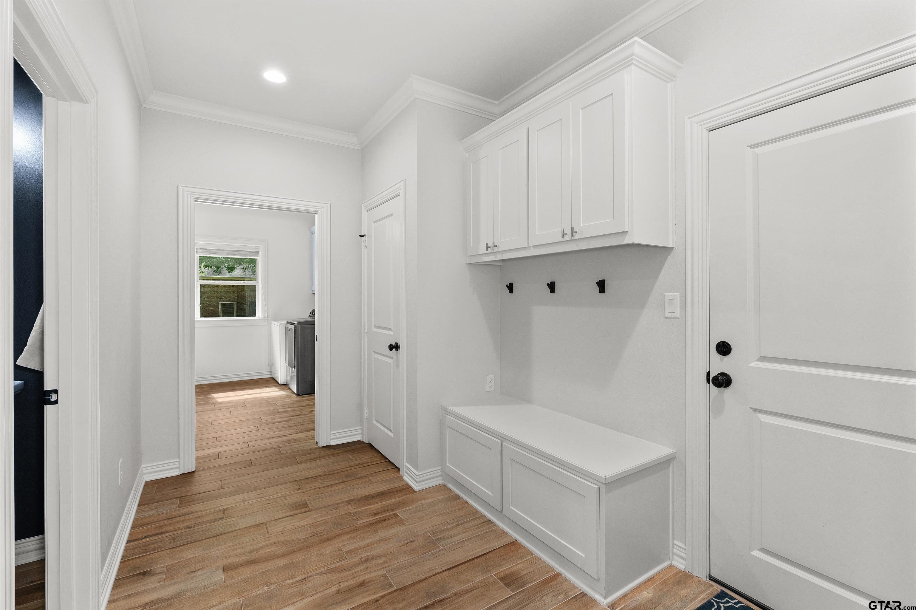 434 King Ranch Road Kilgore, TX 75662 - Photo 24 of 34 a view of a hallway with wooden floor