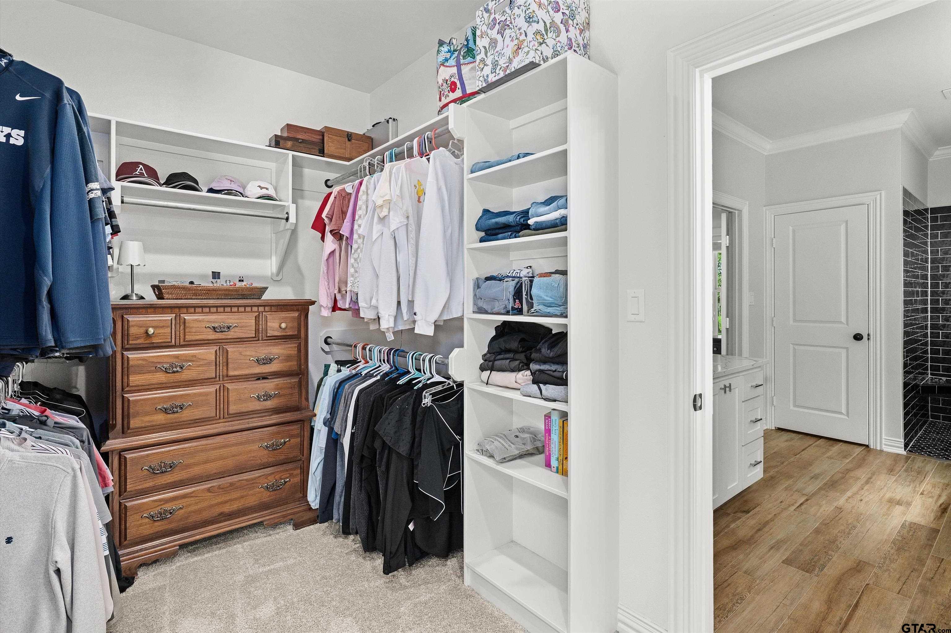 434 King Ranch Road Kilgore, TX 75662 - Photo 28 of 34 a view of walk in closet with clothes and shoes