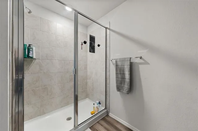 a spacious bathroom with a double vanity sink and mirror