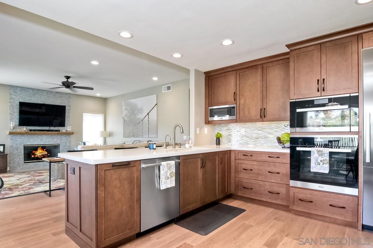 1754 Orchard Wood Road Encinitas, CA 92024 - Photo 13 of 25 and open to family room and back yard play area.