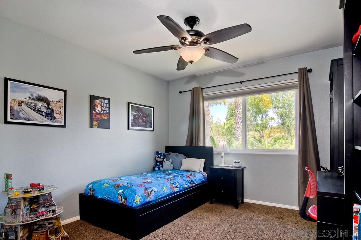 1754 Orchard Wood Road Encinitas, CA 92024 - Photo 22 of 25 3rd Bedroom, custom CA closets.