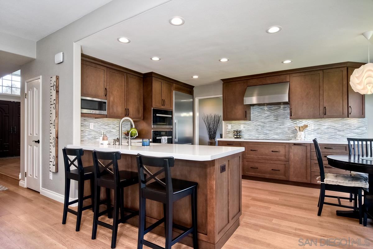 1754 Orchard Wood Road Encinitas, CA 92024 - Photo 10 of 25 Custom cabinetry in your new open kitchen.