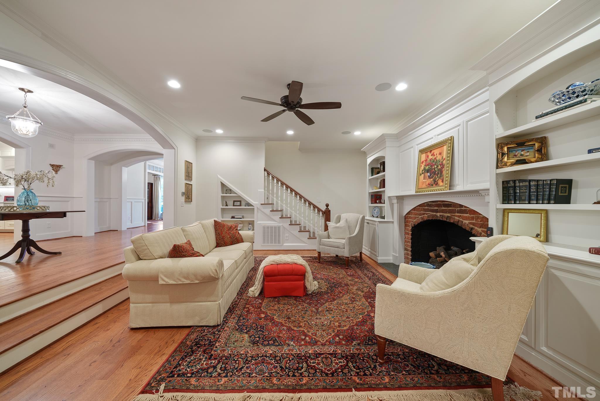 204 Queensferry Road Cary, NC 27511 - Photo 11 of 41 a living room with furniture ceiling fan and a rug