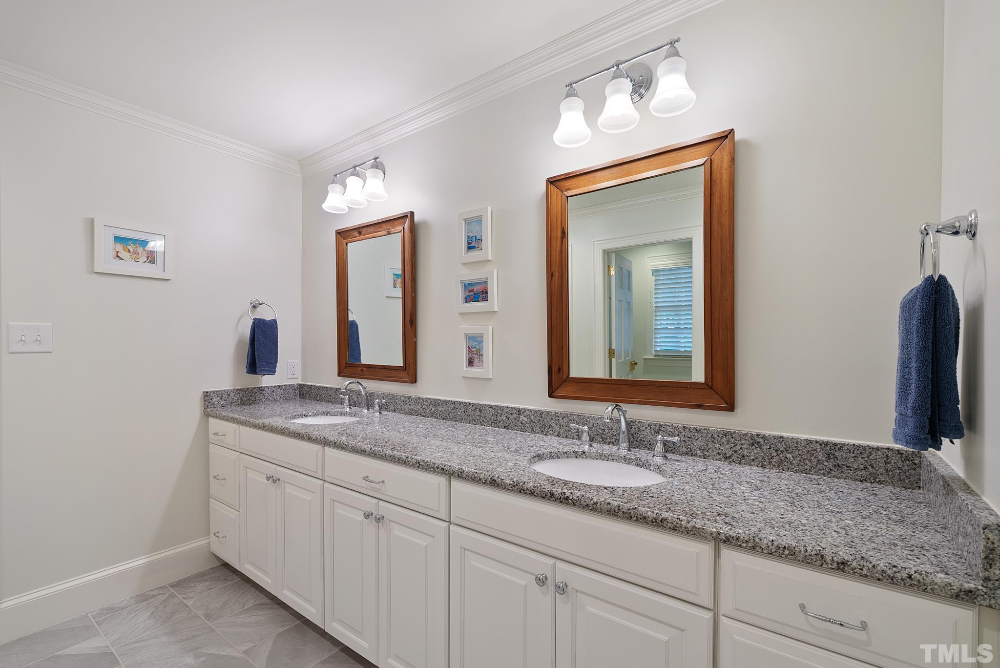 204 Queensferry Road Cary, NC 27511 - Photo 24 of 41 a bathroom with a granite countertop sink and a mirror