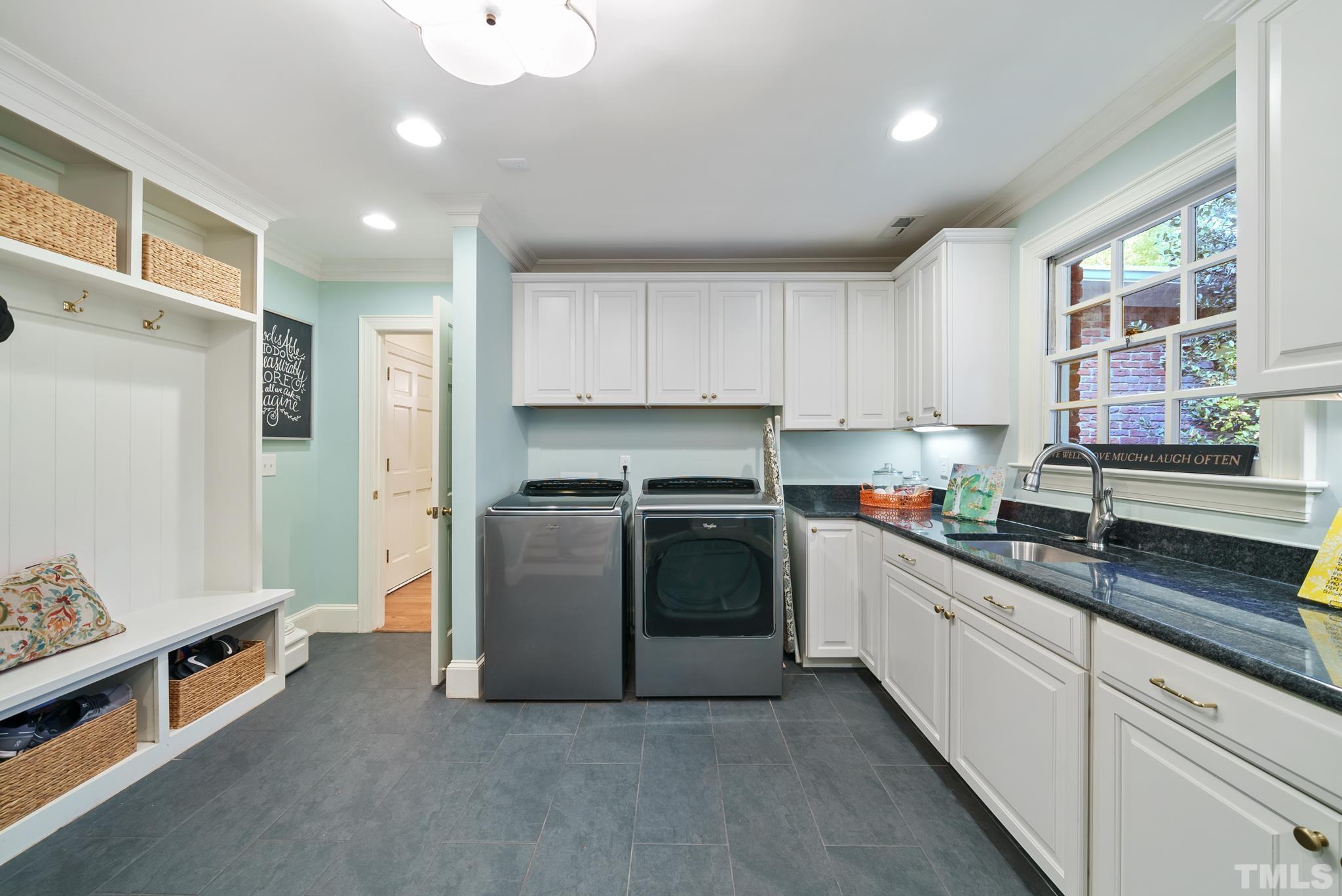 204 Queensferry Road Cary, NC 27511 - Photo 26 of 41 a kitchen with stainless steel appliances granite countertop a stove a sink and a refrigerator