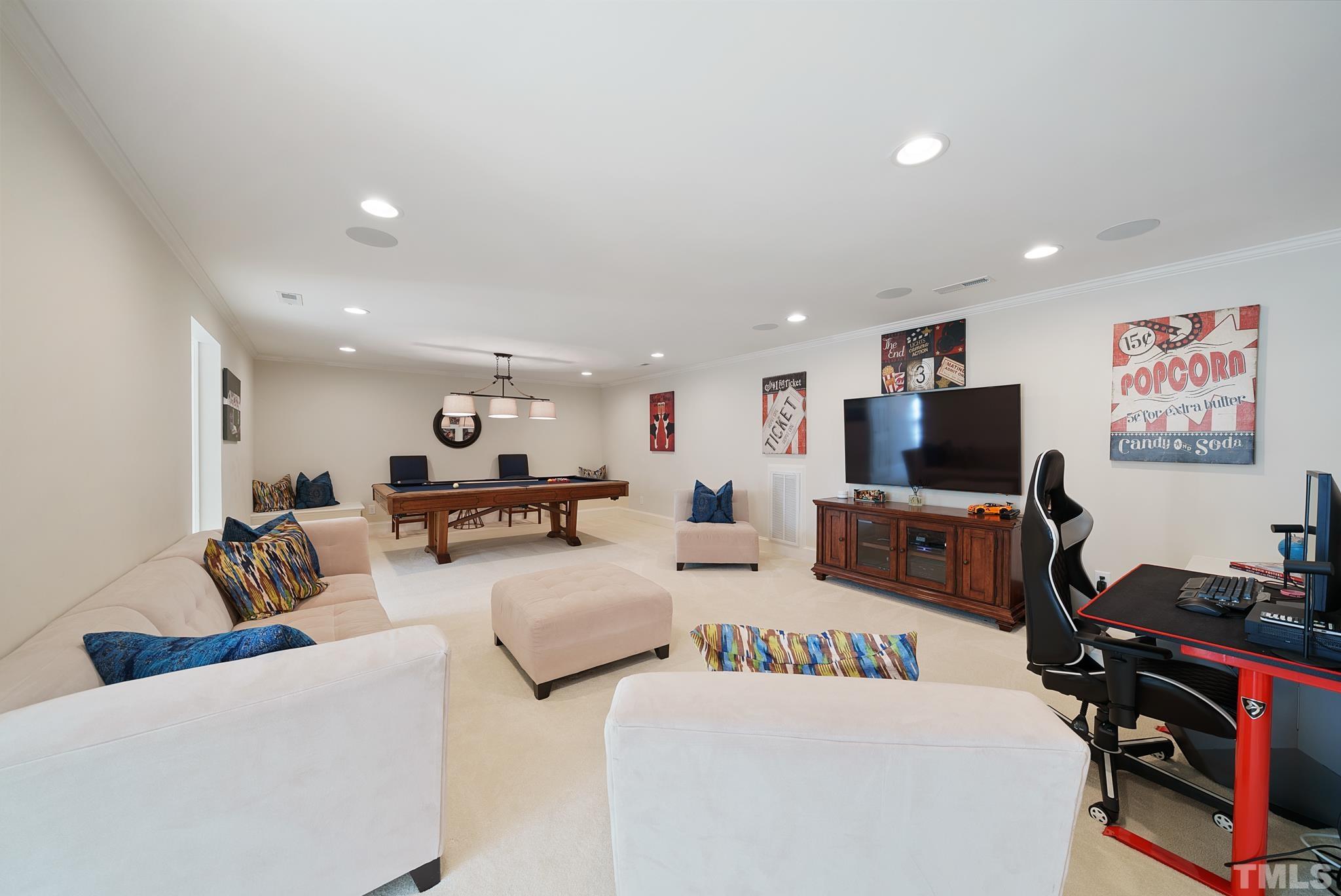 204 Queensferry Road Cary, NC 27511 - Photo 29 of 41 a living room with furniture and a flat screen tv