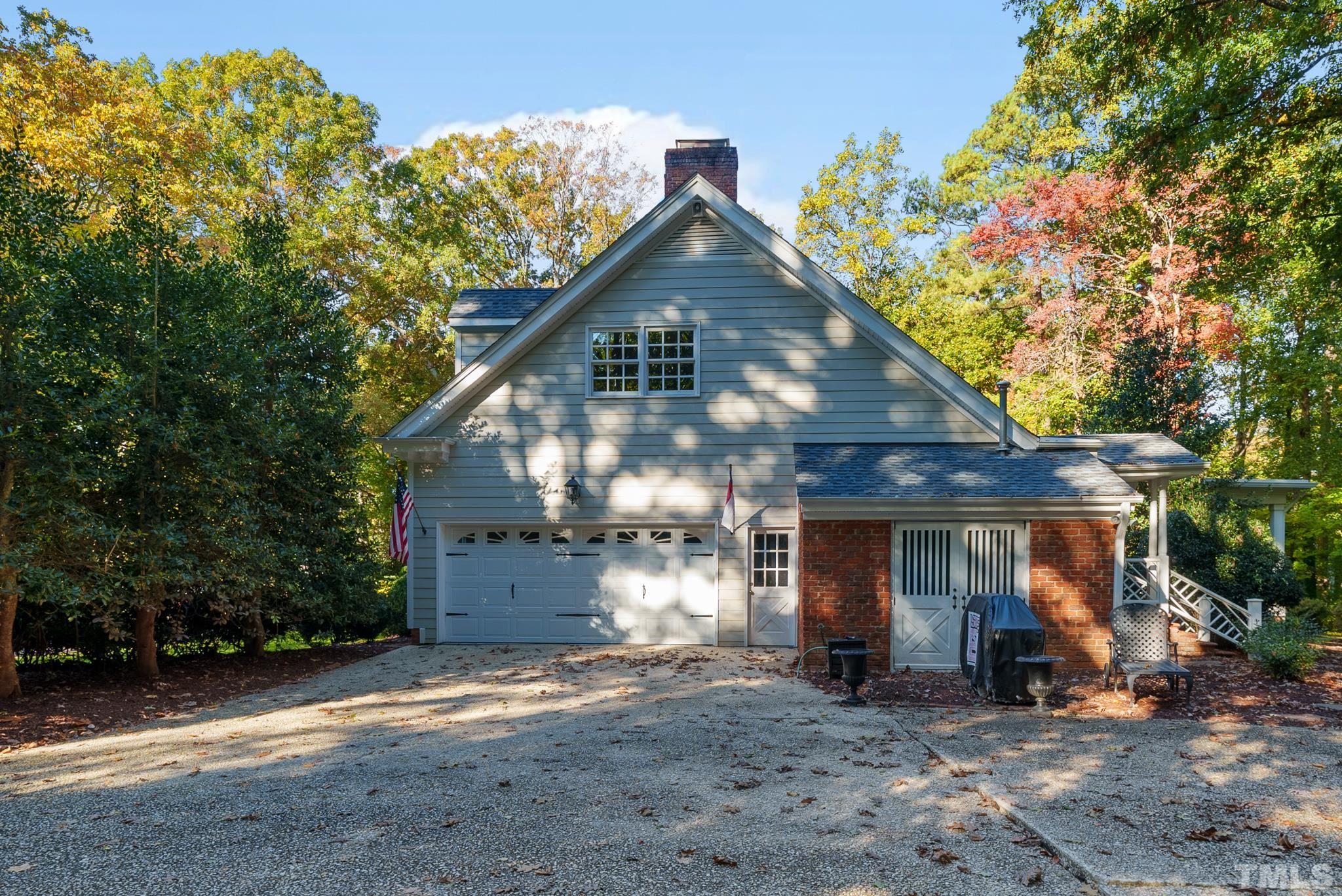 204 Queensferry Road Cary, NC 27511 - Photo 32 of 41 a front view of a house with a yard and garage