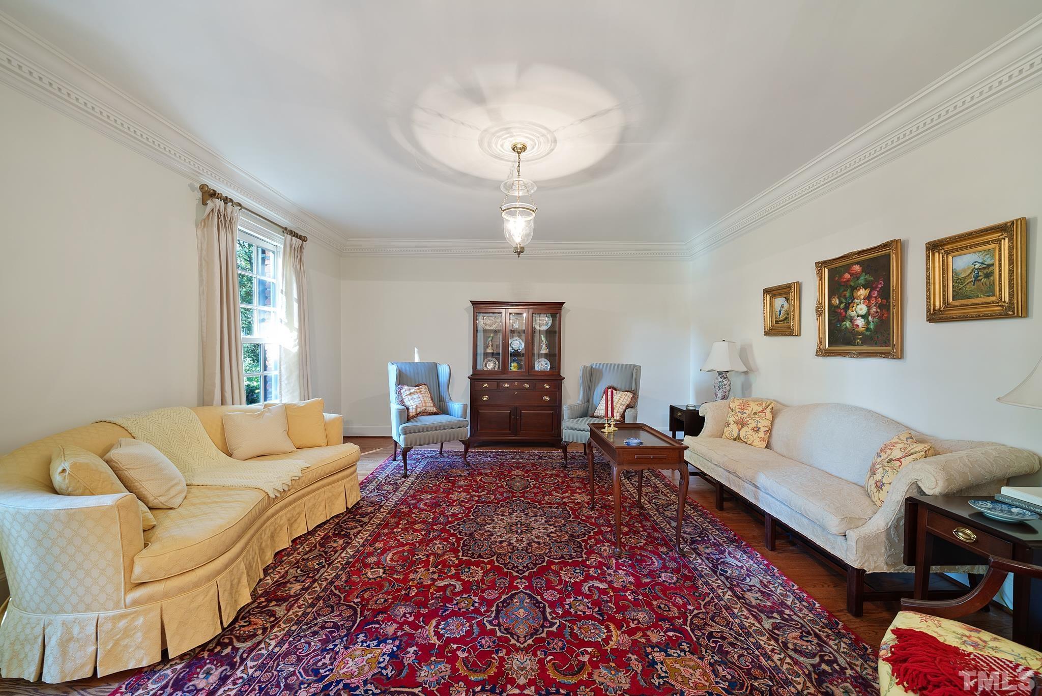 204 Queensferry Road Cary, NC 27511 - Photo 5 of 41 a living room with furniture and a chandelier