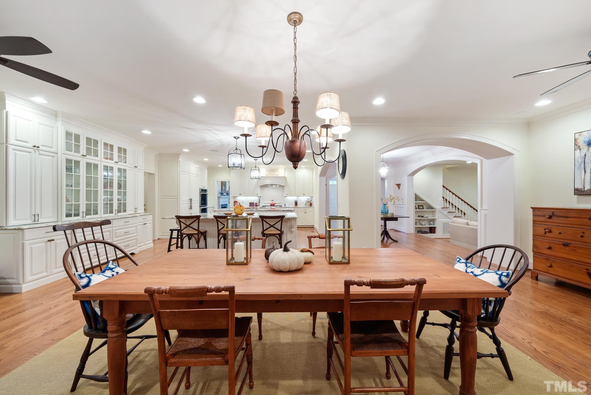 204 Queensferry Road Cary, NC 27511 - Photo 10 of 41 a dining room filled chandelier and wooden floor