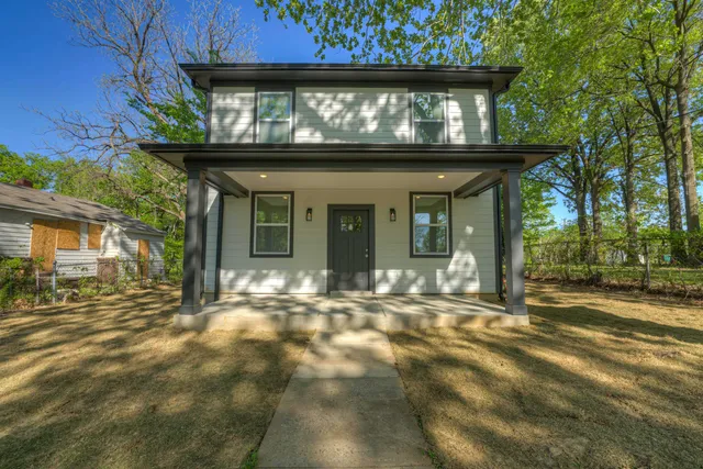 a view of entrance gate of a house