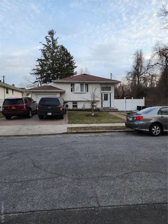 a view of a cars parked in front of a house