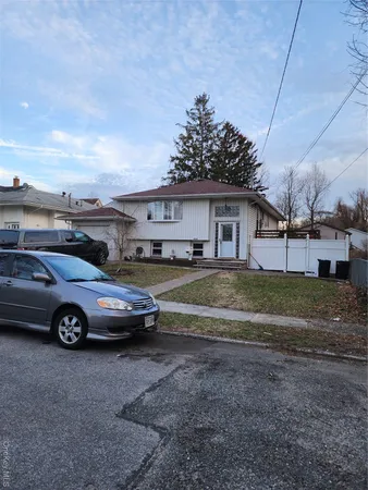 a view of a car parked in front of a house