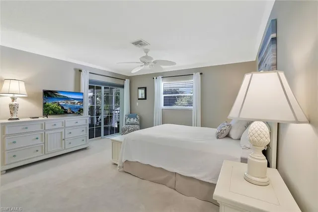 a bedroom with furniture and a window