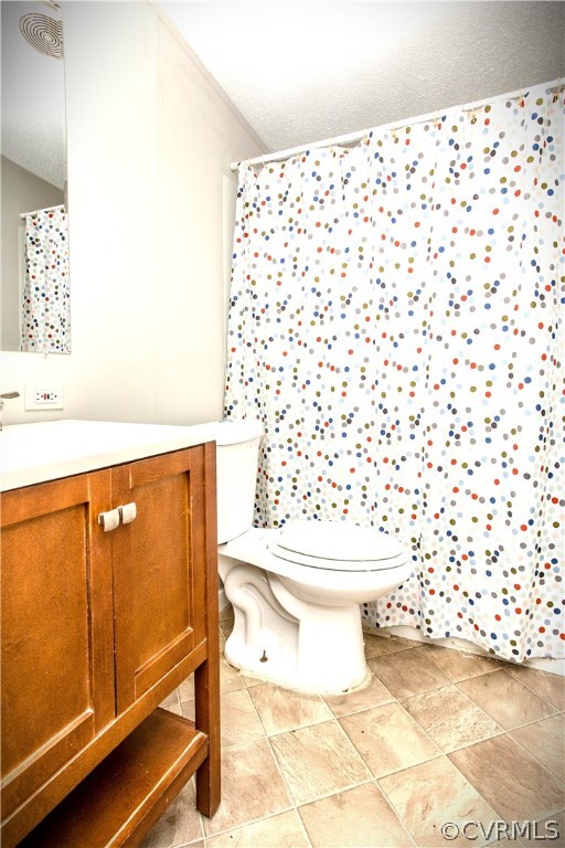 17208 Hamilton Arms Road Dewitt, VA 23840 - Photo 11 of 14 a bathroom with a toilet and a shower curtain