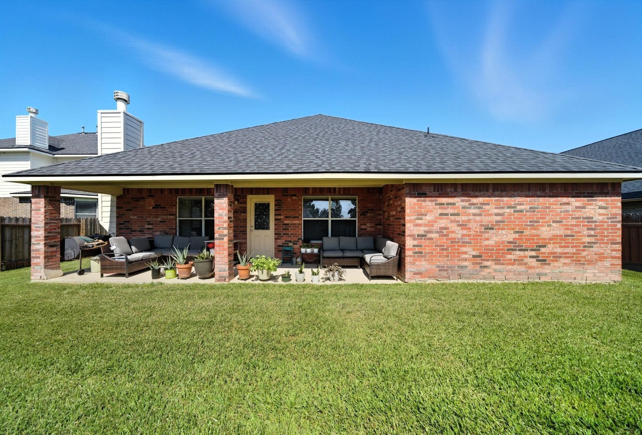 25707 Crisp Spring Lane Spring, TX 77373 - Photo 10 of 14 a front view of a house with garden and sitting area