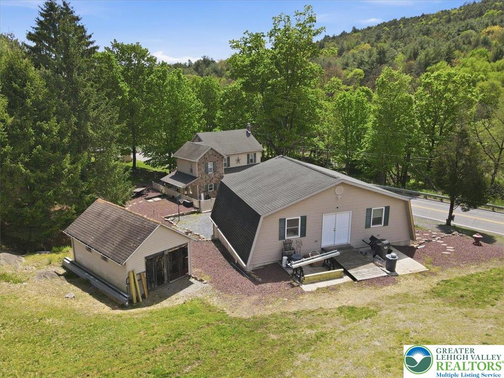 4880 Little Gap Road Kunkletown, PA 18058 - Photo 84 of 100 This charming property features multiple structures nestled among lush trees with scenic views.