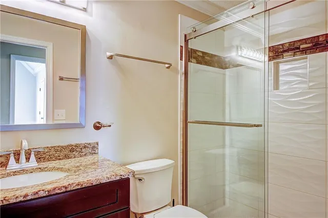 a view of empty room with ceiling fan