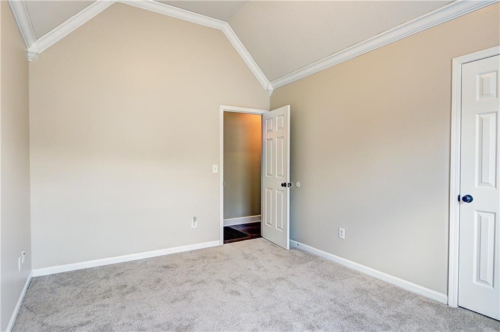 2415 Marsh Rabbit Bend Decatur, GA 30035 - Photo 17 of 18 an empty room with an entryway door