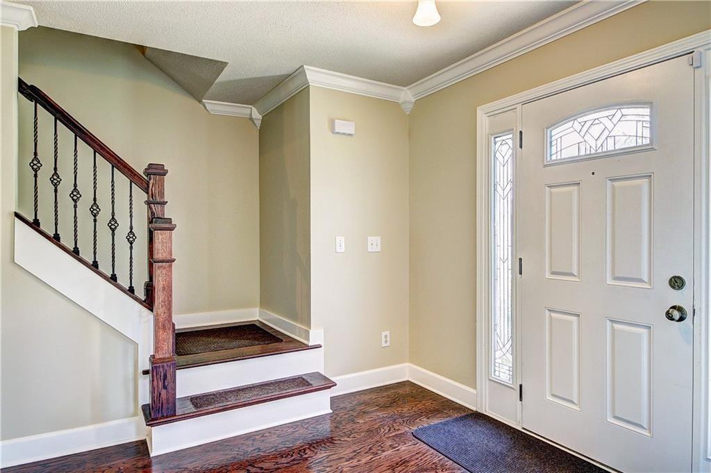 2415 Marsh Rabbit Bend Decatur, GA 30035 - Photo 2 of 18 a view of front door with wooden floor and stairs