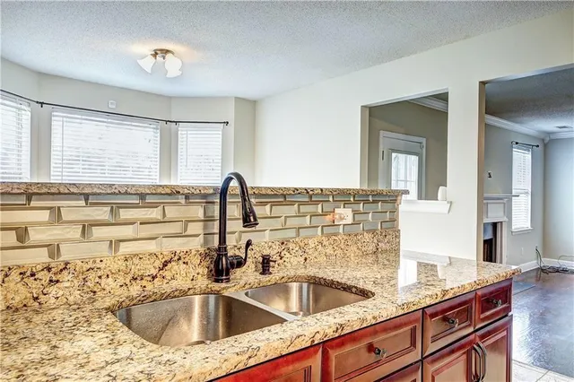 a stove top oven sitting inside of a kitchen