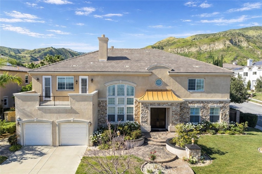 18549 Clydesdale Road Granada Hills, CA 91344 - Photo 1 of 56 a front view of a house with a yard