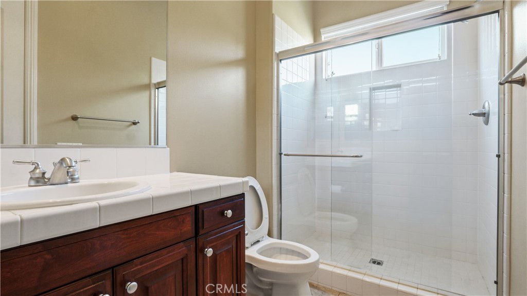 18549 Clydesdale Road Granada Hills, CA 91344 - Photo 28 of 56 a bathroom with a sink a toilet and shower