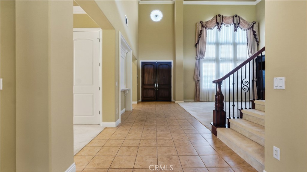 18549 Clydesdale Road Granada Hills, CA 91344 - Photo 8 of 56 a view of a hallway with entryway wooden floor and stairs