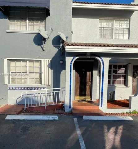 a bedroom with furniture and window