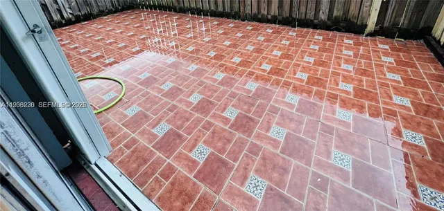 a very nice looking yard from a balcony