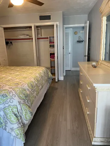 a bedroom with a bed and a dresser