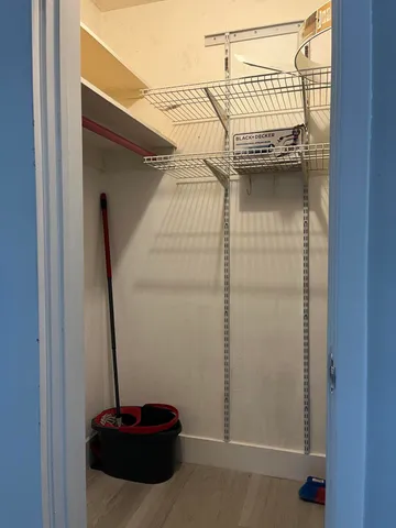 a wooden floor with some trees in the background
