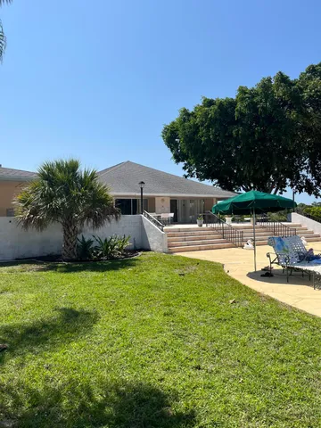a view of swimming pool with an outdoor space and seating area