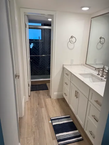 a bathroom with a sink and a mirror