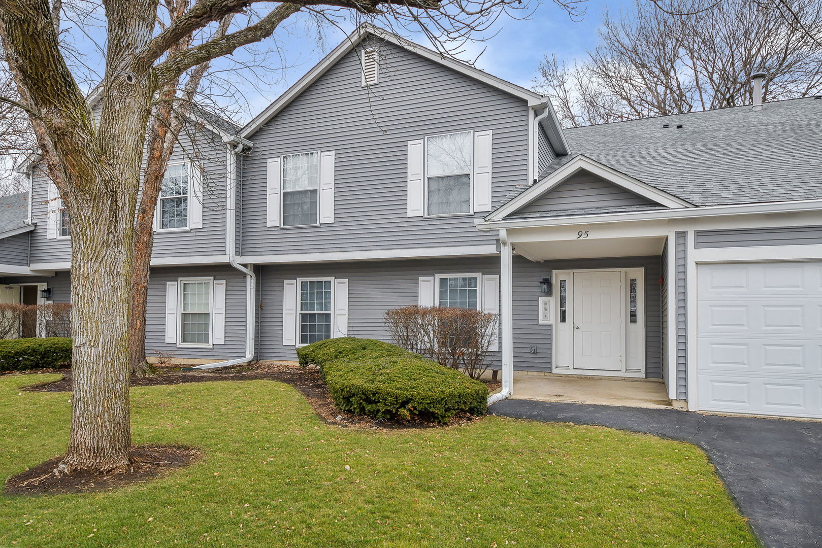 a view of a house with a yard