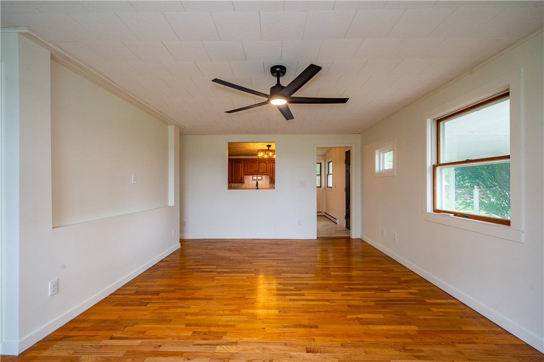 11296 Pansing Road Brookville, OH 45309 - Photo 7 of 53 This inviting space features lustrous wood floors and an open pass-through to the kitchen.