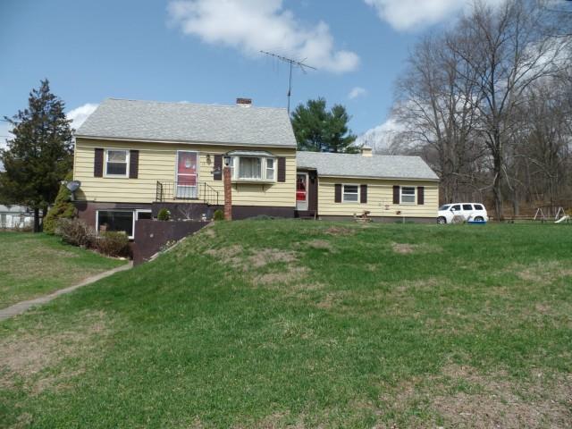 17 Evergreen Road Newtown, CT 06482 - Photo 1 of 1 a front view of a house with a garden