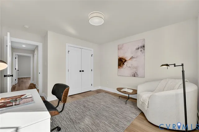 a bedroom with furniture and a window