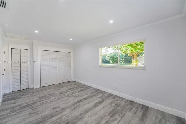 a bathroom with a toilet and shower