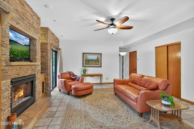 a living room with furniture a fireplace