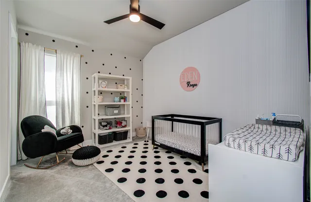 a bedroom with furniture and a window