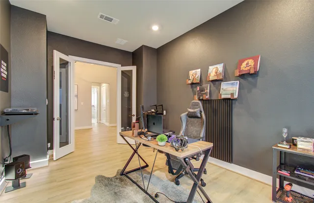 a workspace with furniture and chandelier