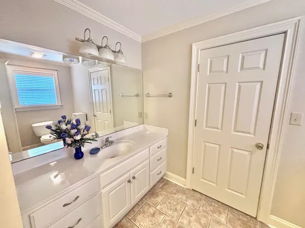 a bathroom with a sink double vanity and a mirror
