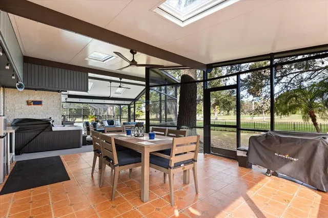 a view of a dining room with furniture wooden floor and a rug