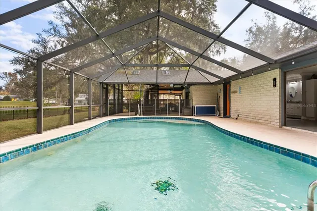 a view of an empty room with a windows and a table